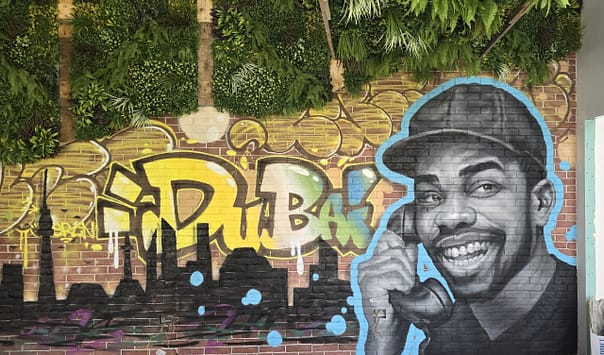 Custom graffiti mural bold lettering realistic portrait for restaurant in dubai downtown
