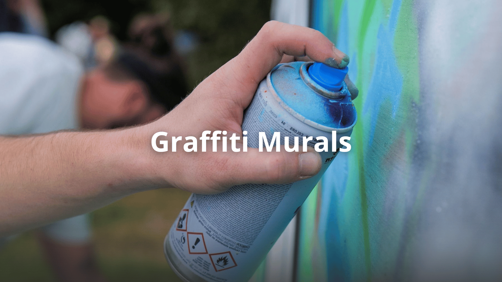 Professional graffiti artist creating a hand-painted mural art for a private space in Dubai UAE